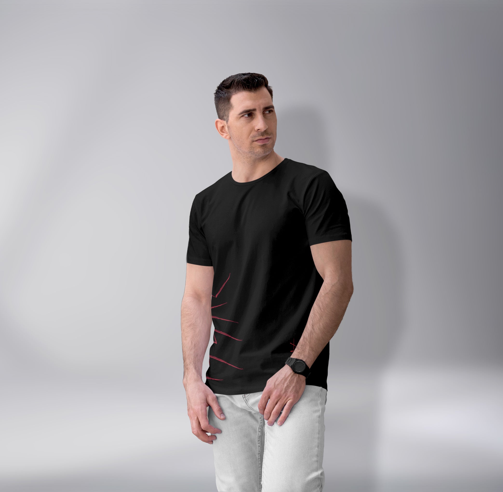 Man wearing a black t-shirt with a subtle design on a gray background